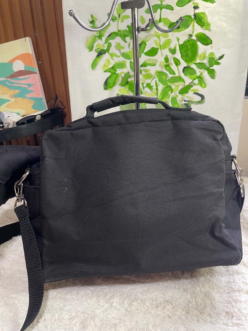 Villand Black sling Bag (Category: Cross-body Bags) located in Naawan. Submitted by twilly.apparel2 (Listing ID 1465978578, Image 3). Description: - issue sa loob Brand: Villand - Color: Solid black canvas with silver hardware - Storage: Multiple front zipped compartments for small items - Carrying Options: Sturdy top handle and long adjustable strap - Best For: Daily commutes, work, and everyday use.