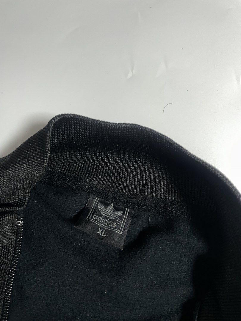 Vintage adidas track jacket (Category: Coats, Jackets and Outerwear) located in Bais. Submitted by christian.complexthrift08 (Listing ID 1466081025, Image 3). Description: Vintage Adidas track jacket (In excellent Condition) Color: black / white Size: small best fit Width: 20.5 inches Length: 24 inches Condition: 9.5 / 10 Issue: barely noticeable signs of usage Price: 550 + SF Via JNT express.