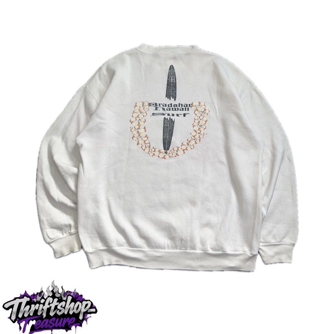 Vintage Bradshaw Hawaii Surf (Category: Coats, Jackets and Outerwear) located in Quezon City. Submitted by thriftshop_treasure (Listing ID 1466106055, Image 1). Description: vintage white crewneck sweatshirt featuring a surfboard and floral lei graphic on the back with “Bradshaw Hawaii Surf” 25x28.