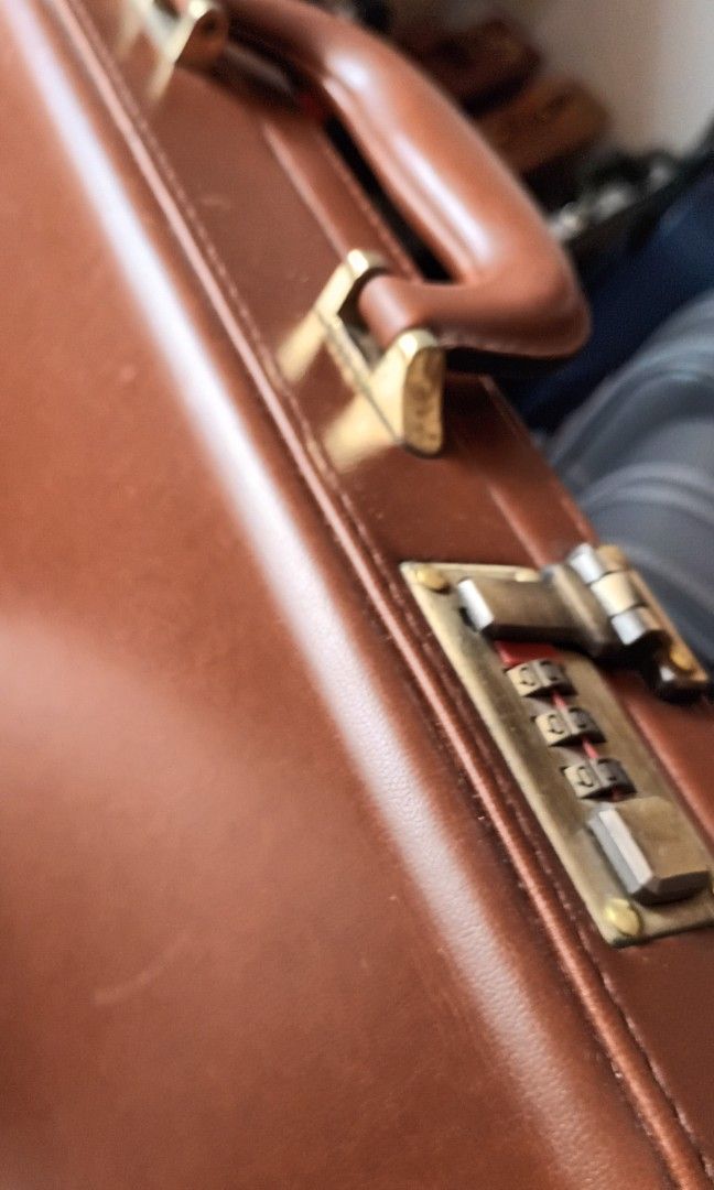 Vintage Brown Leather Attache Case (Category: Briefcases) located in Quezon City. Submitted by happyvintage49 (Listing ID 1466104532, Image 2). Description: - Vintage Samsonite attache case - Stylish all-brown exterior finish - Clean brown and light fabric interior with built-in organizers - Built-in combination lock for security - Perfect for work, meetings, and safekeeping of important/confidential documents - Also perfect for retro OOTDs Note: