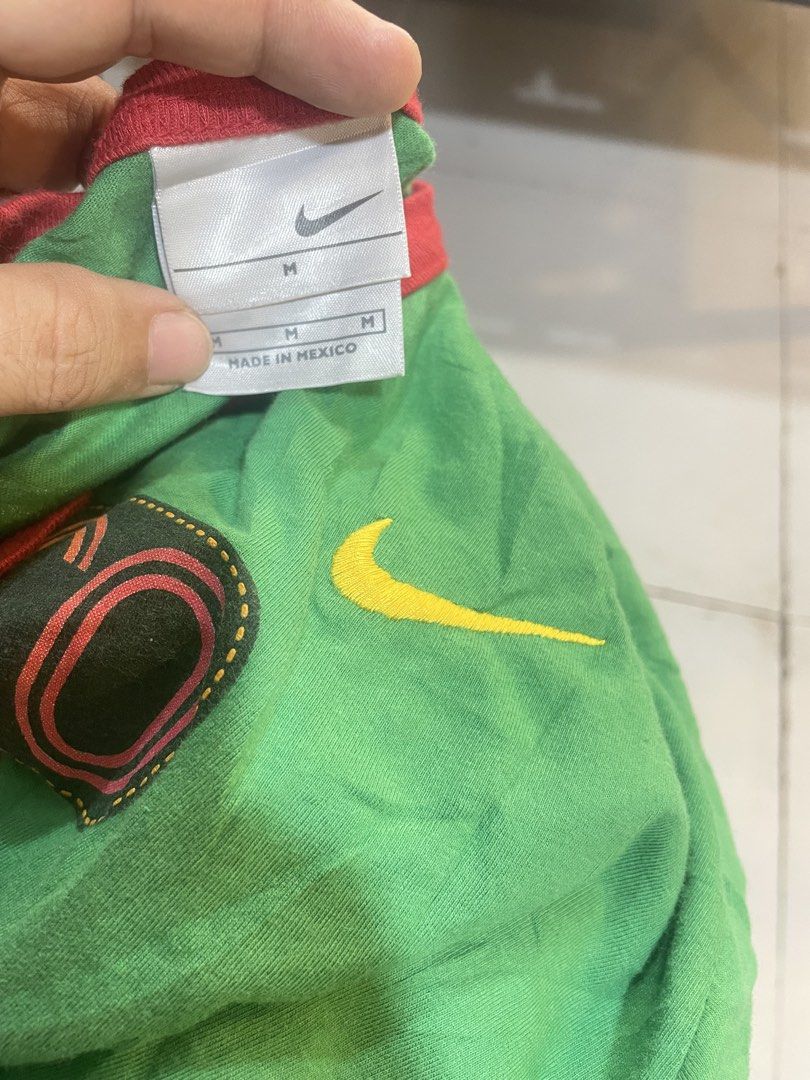 Vintage bundle (Category: Tshirts & Polo Shirts ) located in Manila. Submitted by clementdav22513 (Listing ID 1465982746, Image 3). Description: - Bundle of 2 green graphic tees - Item 1: Nike Mexico ringer shirt, red collar, yellow swoosh, size M, made in Mexico - Item 2: Thunder Creek Dr. Seuss The Grinch Stole Christmas ringer tee, dark green collar, size L - Both feature front graphics and ribbed collars - Fast shipping and trusted seller.