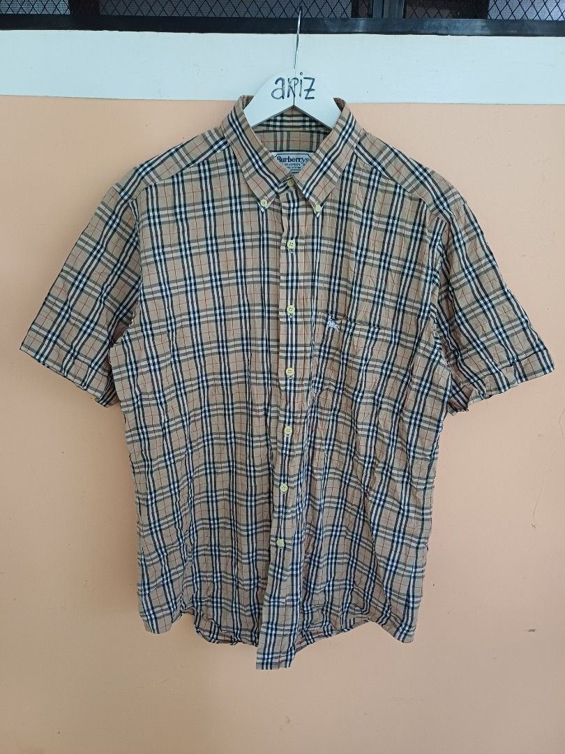 Vintage Burberrys Plaid Polo (Category: Luxury Apparel) located in Davao. Submitted by phgrails082 (Listing ID 1465954100, Image 1). Description: Vintage Burberrys Plaid Polo Large to XL , 23w x 29L Good as new condition 1,300 add shipping fee.
