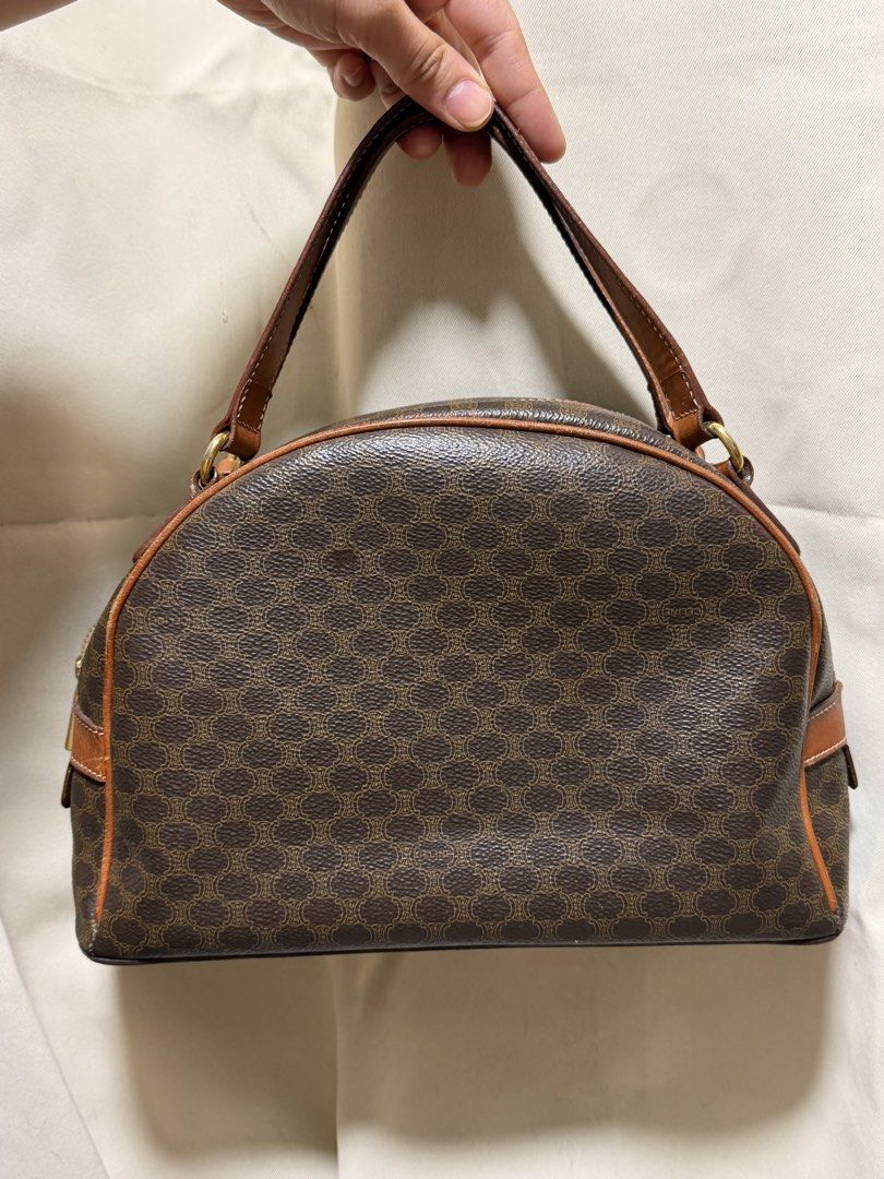 Vintage Celine Macadam (Blazon / Triomphe pattern) Dome / Half-Moon Top-Handle Handbag With Certificate (Category: Purses & Pouches) located in Carmona. Submitted by vetaesencial (Listing ID 1466023098, Image 2). Description: Comes with VEREEV certificate 100% Guaranteed Authentic Swiss-made riri zipper hardware on the interior/exterior, heat-stamped CELINE PARIS / MADE IN ITALY leather tag, and serial code M95 Patina vachetta / tanned leather Cl