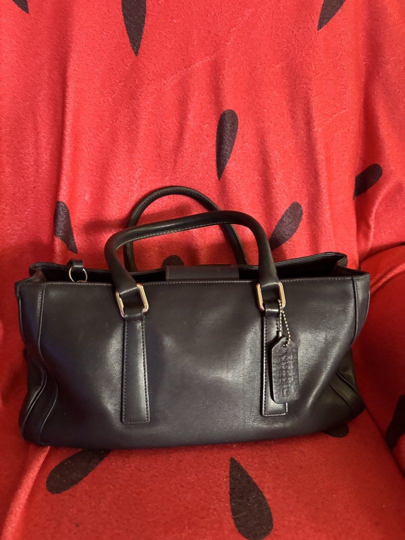 Vintage Coach Leather Handbag (Category: Luxury Bags & Wallets) located in Bacoor. Submitted by yehyeh01 (Listing ID 1465977129, Image 1). Description: - Material: Genuine black leather, crafted in Costa Rica - Design: Structured silhouette with dual top handles and gold-tone hardware - Interior: Fabric-lined with zippered main compartment and authentic creed patch (B1P-9419) - Inclusion: Original hangtag attached to the front strap - Condition: 