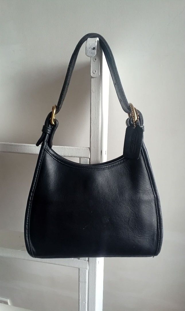 Vintage Coach Soho Small (Category: Luxury Bags & Wallets) located in Quezon City. Submitted by beccathrift (Listing ID 1466096290, Image 3). Description: Japan sourced original vintage COACH. The Vintage Coach Soho Small is a classic 1998 top-handle leather bag crafted in the United States from thick, premium black leather. Includes the original leather hangtag. Key Specifications: • Dimensions: Approximately 8.25" W x 7.5" H x 3" D • Hardware: 