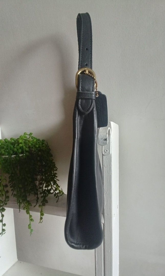 Vintage Coach Soho Small (Category: Luxury Bags & Wallets) located in Quezon City. Submitted by beccathrift (Listing ID 1466096290, Image 2). Description: Japan sourced original vintage COACH. The Vintage Coach Soho Small is a classic 1998 top-handle leather bag crafted in the United States from thick, premium black leather. Includes the original leather hangtag. Key Specifications: • Dimensions: Approximately 8.25" W x 7.5" H x 3" D • Hardware: 