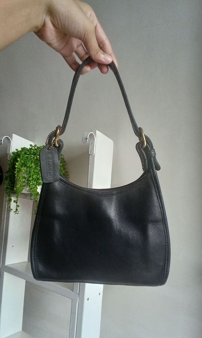 Vintage Coach Soho Small (Category: Luxury Bags & Wallets) located in Quezon City. Submitted by beccathrift (Listing ID 1466096290, Image 1). Description: Japan sourced original vintage COACH. The Vintage Coach Soho Small is a classic 1998 top-handle leather bag crafted in the United States from thick, premium black leather. Includes the original leather hangtag. Key Specifications: • Dimensions: Approximately 8.25" W x 7.5" H x 3" D • Hardware: 