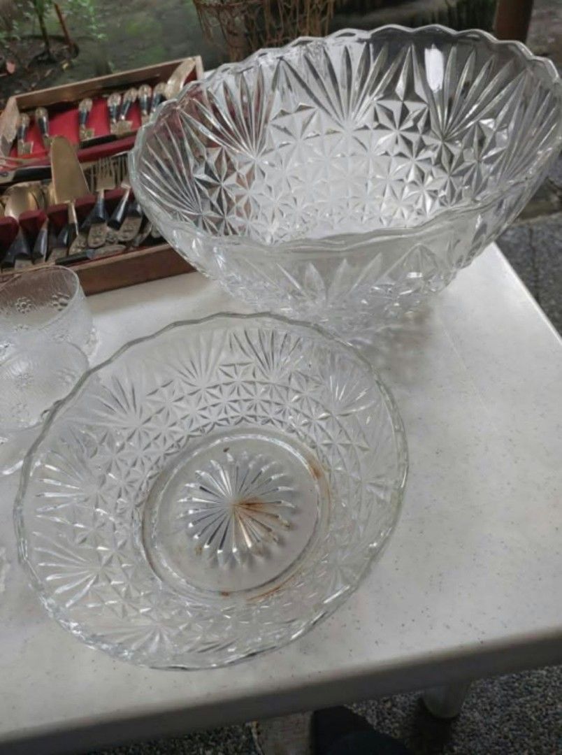 Vintage Crystal Punch Bowl Set (Category: Dinnerware & Cutlery) located in Las Pinas. Submitted by michtradingandventures (Listing ID 1465984216, Image 1). Description: - Set includes: 1 large crystal punch bowl and 1 matching smaller bowl - Design: Intricate starburst and diamond cut patterns with elegant scalloped rims - Material: Heavy, premium-quality clear glass construction - Perfect for: Parties, fiestas, family gatherings, and holiday hos