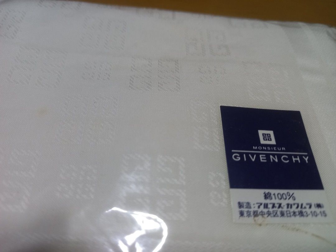 Vintage Givenchy Handkerchief 100% Cotton (Category: Handkerchief & Pocket Squares) located in Manila. Submitted by riaring88 (Listing ID 1466087412, Image 1). Description: - Brand: Givenchy - Color: Classic White - Material: 100% Premium Cotton - Design: Jacquard-woven 4G monogram pattern with printed Givenchy brand name near the border - Condition: Brand new, sealed in original plastic packaging with official brand label sticker - Ideal for per