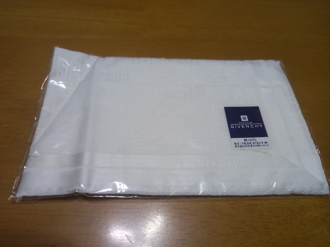 Vintage Givenchy Handkerchief 100% Cotton (Category: Handkerchief & Pocket Squares) located in Manila. Submitted by riaring88 (Listing ID 1466087412, Image 3). Description: - Brand: Givenchy - Color: Classic White - Material: 100% Premium Cotton - Design: Jacquard-woven 4G monogram pattern with printed Givenchy brand name near the border - Condition: Brand new, sealed in original plastic packaging with official brand label sticker - Ideal for per