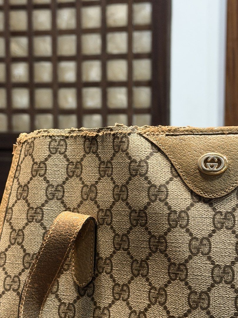 Vintage Gucci Monogram Canvas Tote Bag (Category: Luxury Bags & Wallets) located in Las Pinas. Submitted by 4fc4da554628523b1a7a6f2572133d (Listing ID 1466103326, Image 3). Description: - Authentic Gucci GG monogram coated canvas tote - Features dual leather shoulder straps and gold-tone hardware - Condition: Heavy wear on handles (peeling/cracking) and top trim (fraying/scuffs) - Great project piece for restoration or as a vintage daily runner -