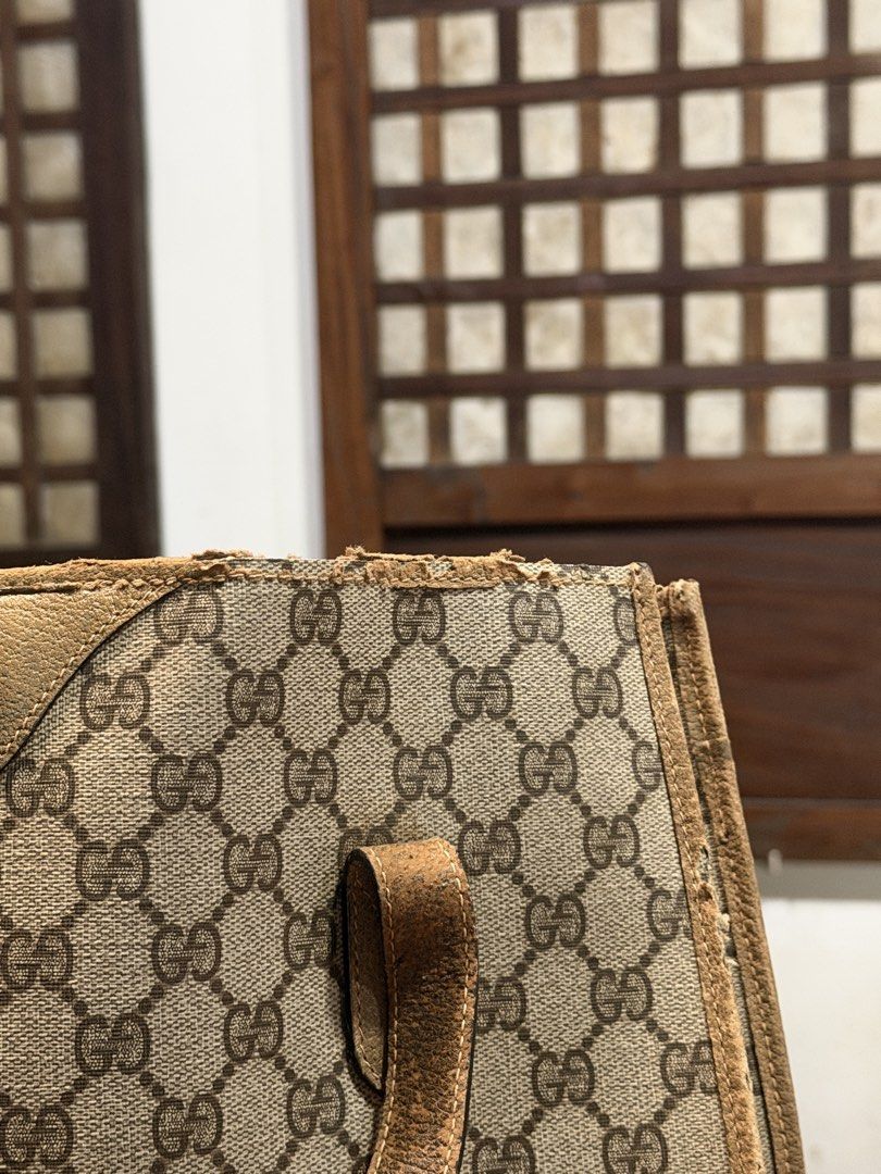 Vintage Gucci Monogram Canvas Tote Bag (Category: Luxury Bags & Wallets) located in Las Pinas. Submitted by 4fc4da554628523b1a7a6f2572133d (Listing ID 1466103326, Image 2). Description: - Authentic Gucci GG monogram coated canvas tote - Features dual leather shoulder straps and gold-tone hardware - Condition: Heavy wear on handles (peeling/cracking) and top trim (fraying/scuffs) - Great project piece for restoration or as a vintage daily runner -