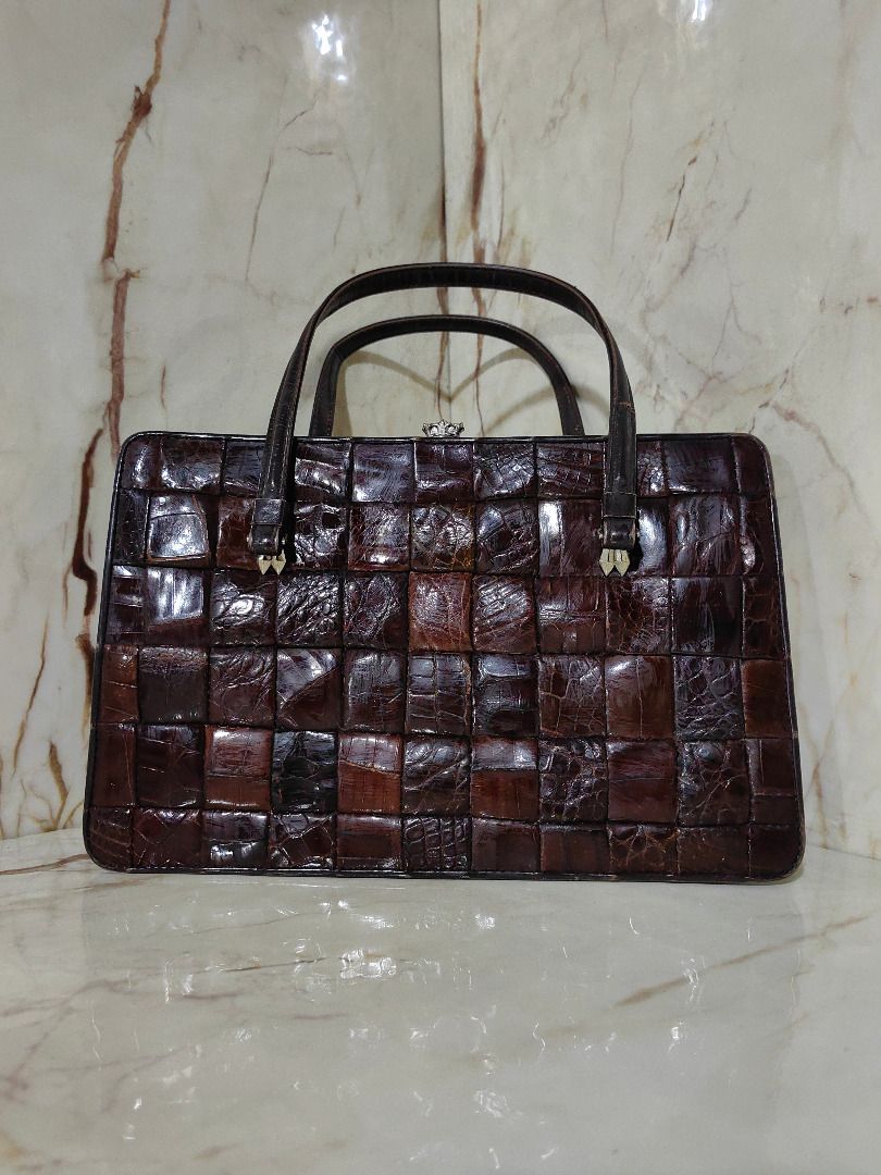 Vintage patchwork crocodile leather handbag with crown clasp (Category: Luxury Bags & Wallets) located in Tarlac. Submitted by jeremiah.curator.2026 (Listing ID 1465992207, Image 1). Description: - Style: Classic retro structured boxy handbag - Material: Rich brown patchwork crocodile leather with great texture - Closure: Metal frame closure featuring a detailed crown design - Handles: Double top handles (Note: noticeable stitch wear on one strap