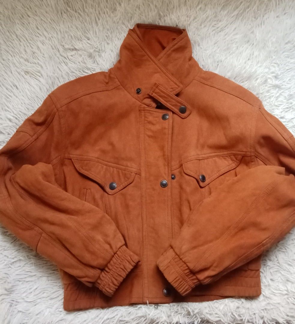Leather Italy Vintage Perfect Suede Bomber Jacket (Category: Coats, Jackets and Outerwear) located in Caloocan City. Submitted by noy5o1a (Listing ID 1465986455, Image 2). Description: - Brand: Perfect - Material: Genuine vintage suede in a striking burnt orange shade - Closure: High collar design with button closure and snap tab - Pockets: Two front flap pockets and convenient side pockets - Fit: Ribbed cuffs and hem to lock in warmth - Interior