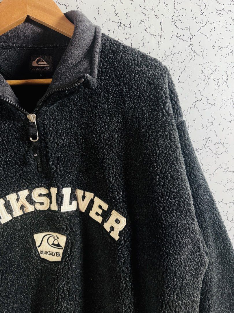Vintage Quiksilver (Category: Coats, Jackets and Outerwear) located in Roxas City. Submitted by patsquarephantz (Listing ID 1466091021, Image 2). Description: - Brand: Quiksilver - Style: Dark grey fuzzy fleece pullover with quarter zip and high collar - Size: L - Details: Large embroidered chest logo with wave patch below - Material: Thick, warm sherpa fabric - Fit: Regular fit, perfect for chilly weather.