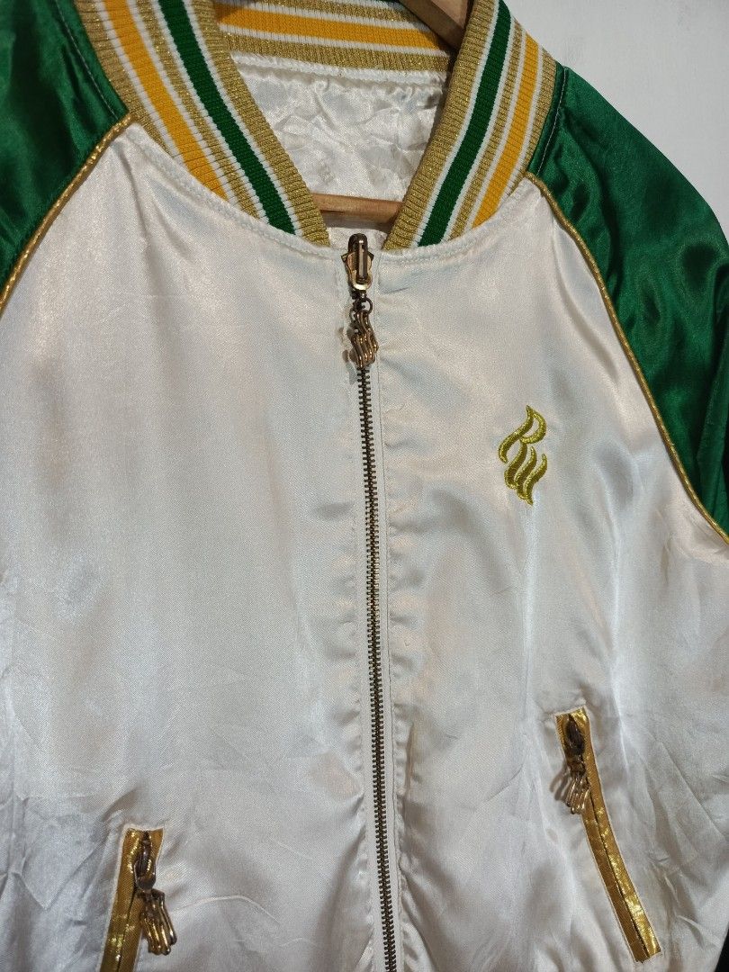VINTAGE ROCAWEAR REVERSIBLE SATIN JACKET (Category: Coats, Jackets and Outerwear) located in Baguio. Submitted by 074thriftmania (Listing ID 1466115712, Image 2). Description: - Brand: Rocawear - Style: Reversible satin bomber jacket - Colorway: Green and white with gold embroidery - Details: Striped ribbed collar, cuffs, and hem, full zip closure, zipped side pockets - Side A: Plain white body, green sleeves, and chest logo embroidery - Side B: 