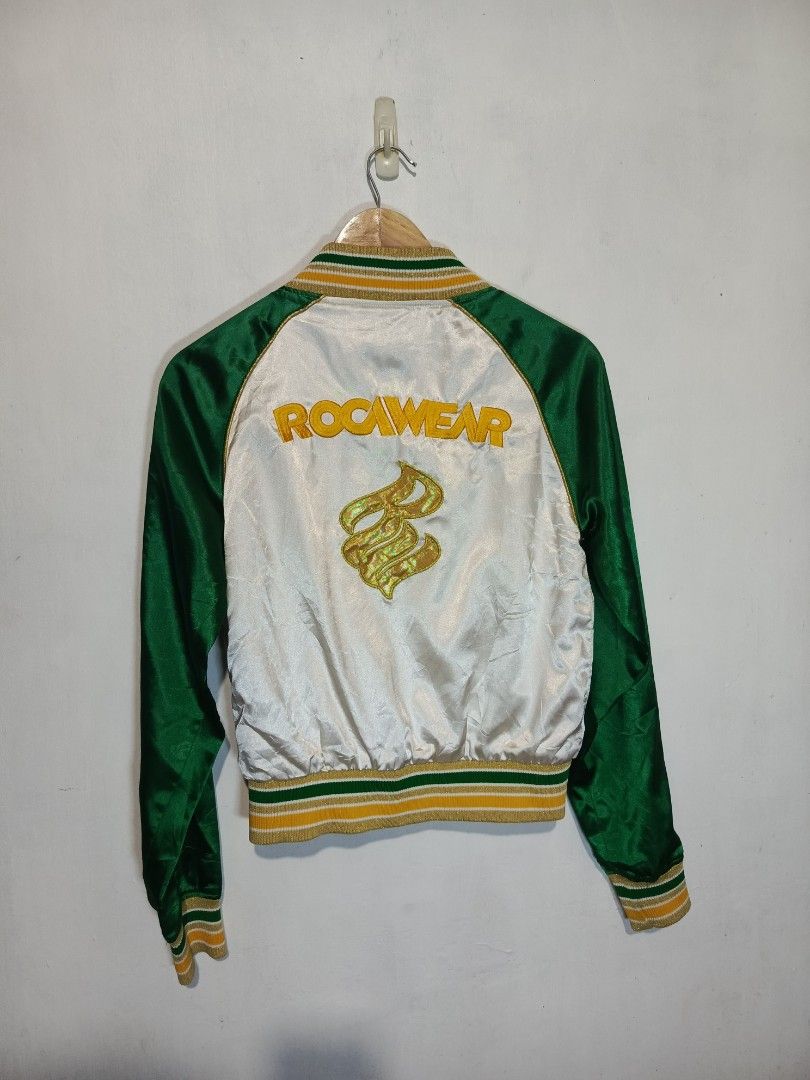 VINTAGE ROCAWEAR REVERSIBLE SATIN JACKET (Category: Coats, Jackets and Outerwear) located in Baguio. Submitted by 074thriftmania (Listing ID 1466115712, Image 3). Description: - Brand: Rocawear - Style: Reversible satin bomber jacket - Colorway: Green and white with gold embroidery - Details: Striped ribbed collar, cuffs, and hem, full zip closure, zipped side pockets - Side A: Plain white body, green sleeves, and chest logo embroidery - Side B: 