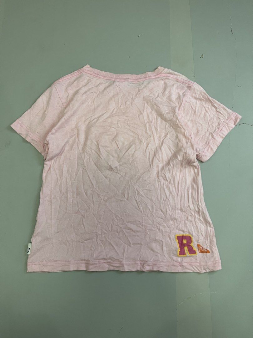 Vintage Roxy Pink Graphic T-Shirt (Category: Shirts) located in Mabalacat. Submitted by aas_thriftfings (Listing ID 1465993398, Image 2). Description: - Brand: Roxy - Color: Pink - Size: Small - Material: 100% Cotton - Design: Large floral 'Roxy 90 Surf All Day' front graphic - Details: Small 'R' logo on lower back hem, short sleeves, ribbed crew neckline - Condition: Excellent, buyer-friendly deal!.