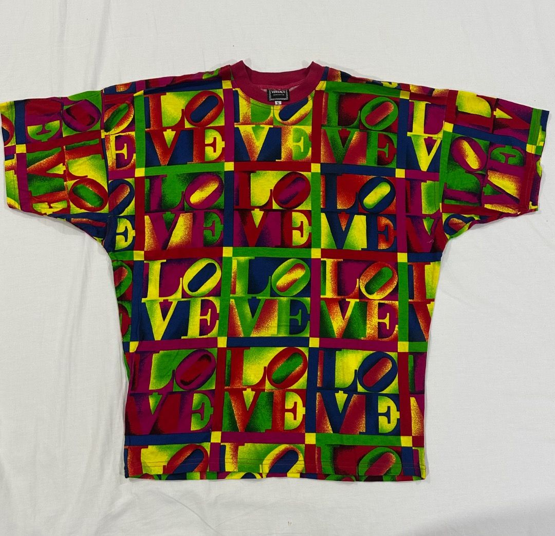 Vintage VERSACE LOVE Shirt (Category: Luxury Apparel) located in San Juan City. Submitted by looneybin559 (Listing ID 1466005312, Image 1). Description: Authentic Gianni Versace LOVE shirt. Vintage. Just in storage. Hard to find. Collector's Item. Runway Piece. Size Small. - Cool vintage t-shirt - Repeating 'LOVE' graphic with a bright, colorful all-over print - Perfect for achieving a retro or unique look - One-of-a-kind piece you won't find eve