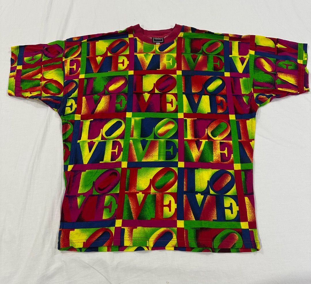 Vintage VERSACE LOVE Shirt (Category: Luxury Apparel) located in San Juan City. Submitted by looneybin559 (Listing ID 1466005312, Image 2). Description: Authentic Gianni Versace LOVE shirt. Vintage. Just in storage. Hard to find. Collector's Item. Runway Piece. Size Small. - Cool vintage t-shirt - Repeating 'LOVE' graphic with a bright, colorful all-over print - Perfect for achieving a retro or unique look - One-of-a-kind piece you won't find eve