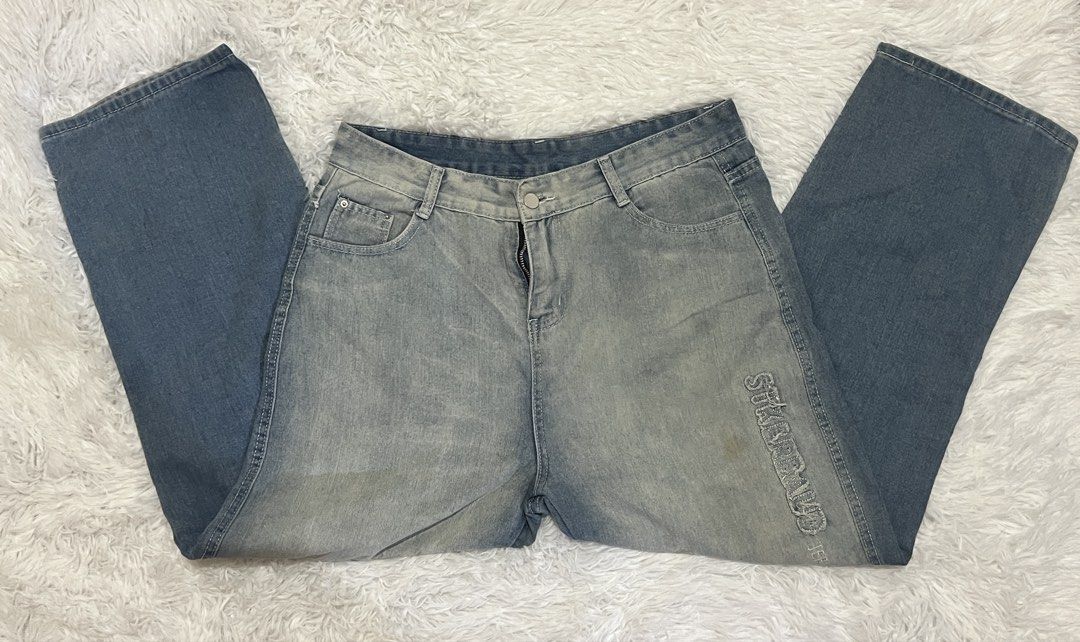 Vintage Wash Distressed Denim Jeans (Category: Jeans) located in Tuguegarao City. Submitted by love_clothies (Listing ID 1465968937, Image 1). Description: - Style: Casual streetwear, relaxed fit - Wash: Two-tone faded with darker legs - Details: Embroidered lettering down the left leg - Features: Button closure, zipped fly, classic five-pocket setup - Width: 17 inch, Length: 40 1/2 inch.