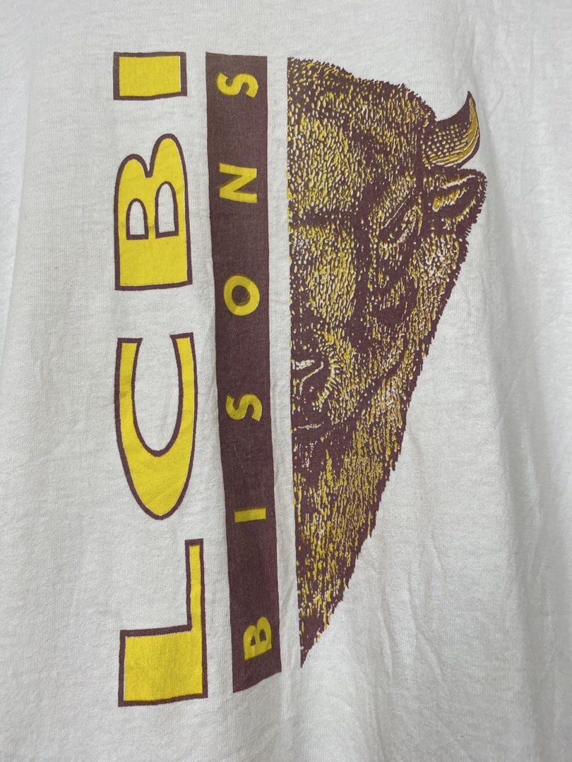 VINTAGE,(LCBI bisons) t-shirt (Category: Tshirts & Polo Shirts ) located in Cavite. Submitted by jc_thrift95 (Listing ID 1466089336, Image 2). Description: - Vintage white graphic t-shirt featuring a “LCBI Bisons” bison head graphic on the front. - Made in USA - Single stitch all the way - L- 28 inch - W- 23 inch - Color rate 8/10 (need wash) - See pictures details for dimes.