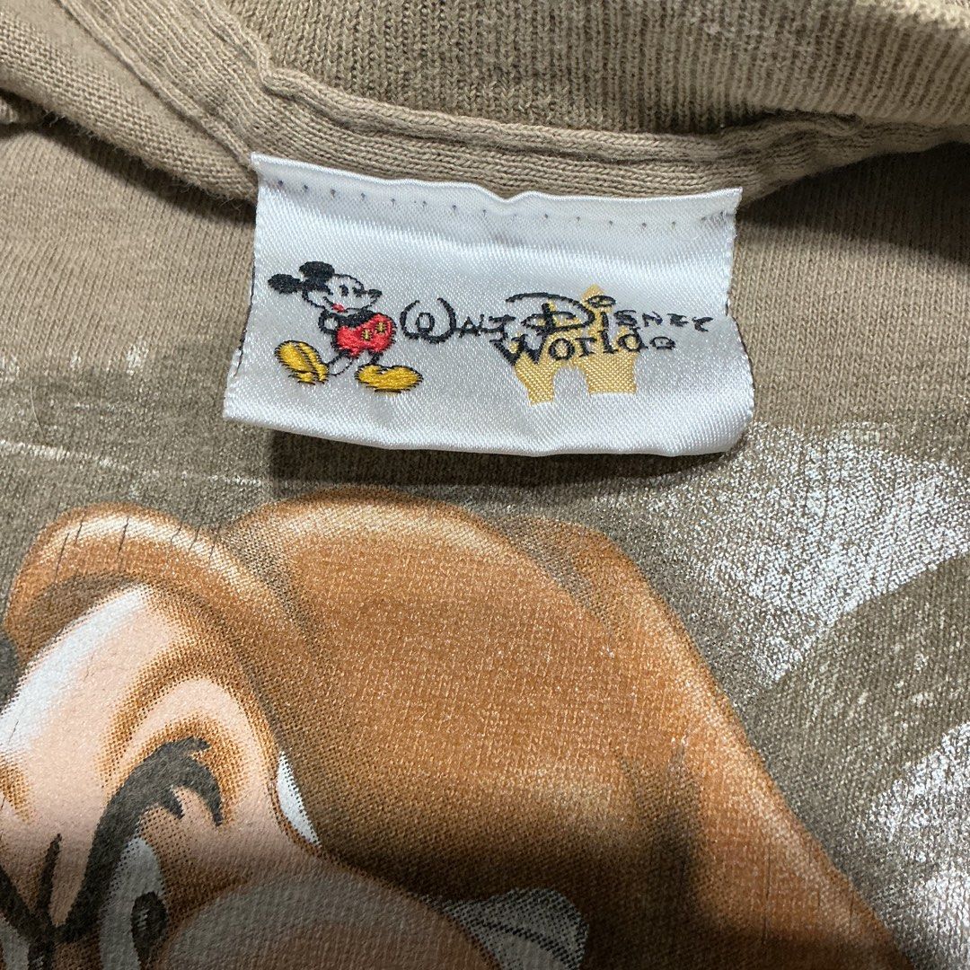 Walt Disney World Grumpy Graphic T-Shirt (Category: Tshirts & Polo Shirts ) located in Naga. Submitted by eunhasowon12391 (Listing ID 1466077840, Image 3). Description: - Authentic Disney World Grumpy graphic tee with the quote "I'm right you're wrong any questions?" - Official Disney tag attached at the inner collar - Relaxed fit with a comfortable, heavyweight cotton feel - Tan colorway - Flaws noted: Noticeable discoloration spots near the bot