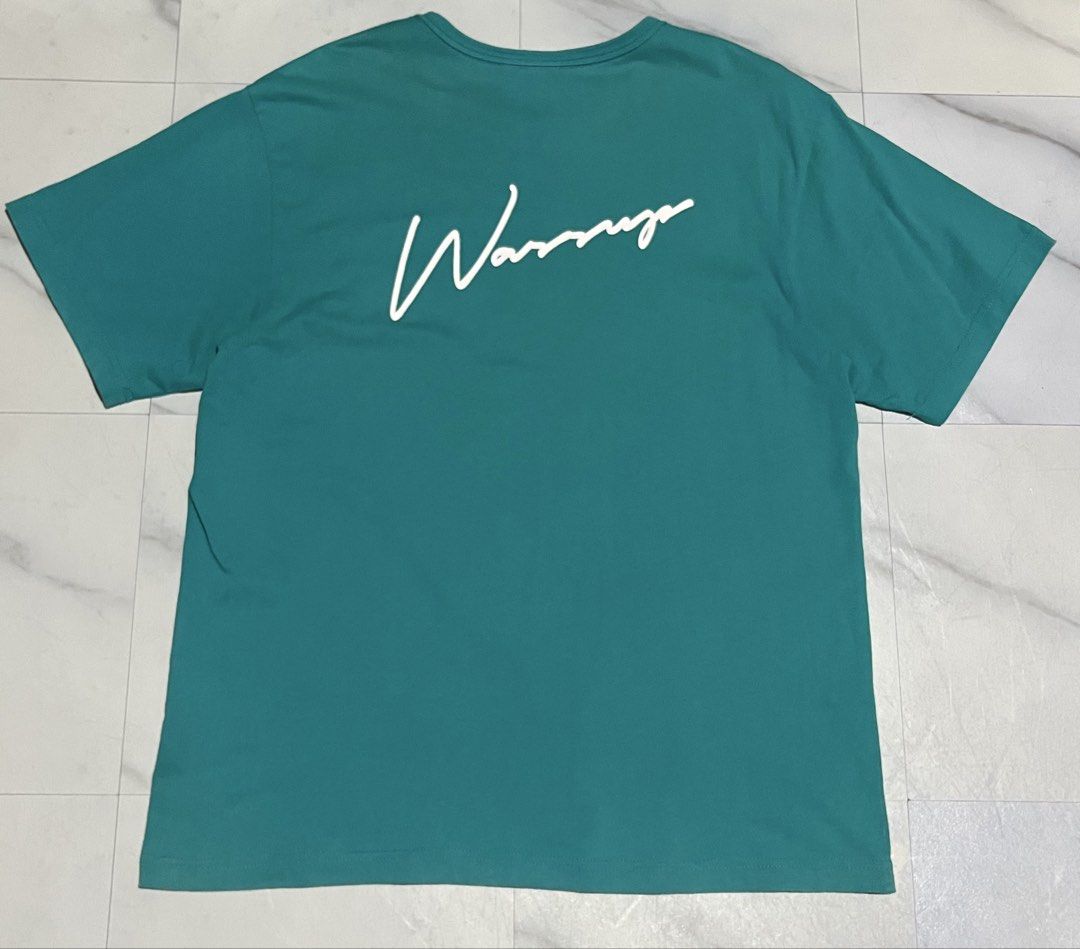 Wassup Teal T-Shirt Size L (Category: Tshirts & Polo Shirts ) located in Cavite. Submitted by christianzuuu (Listing ID 1466102790, Image 1). Description: - Brand: Wassup - Color: Teal green - Size: L (tag attached) - Design: Small left chest graphic with blue brand label, large white cursive print across the back - Details: Crew neck, short sleeves, small blue tag on bottom left hem - Condition: Brand new with tag.