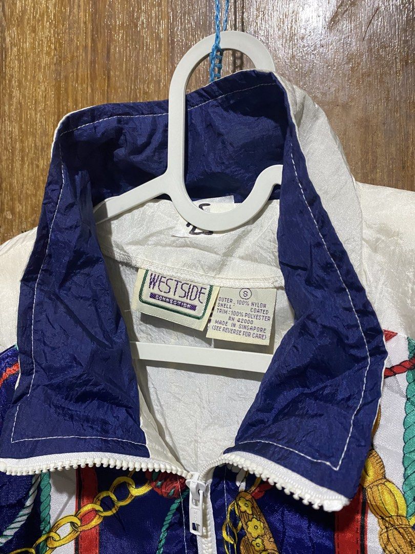 Westside Connection Vintage Baroque Print Windbreaker Jacket (Category: Coats, Jackets and Outerwear) located in Imus. Submitted by frootiloots4103 (Listing ID 1466031562, Image 2). Description: - Brand/Style: Vintage Westside Connection windbreaker - Colorway: White, navy blue, and red - Design: Bold baroque chain and rope pattern on upper chest and back yoke - Material: 100% coated nylon shell with 100% polyester trim (lightweight feel) - Featu