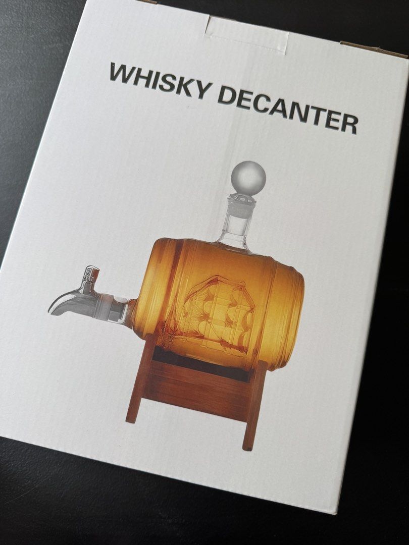 Whisky Decanter Barrel Set Model L023 (Category: Pitchers & Dispensers) located in Quezon City. Submitted by jrc_98 (Listing ID 1465986158, Image 3). Description: - Brand new and factory sealed whisky decanter set (Model: L023) - Unique wooden barrel design featuring an intricate etched ship inside - Includes a convenient glass tap dispenser, sturdy wooden stand, and round stopper - Manufactured by Weifang Blotus Trading Co., Ltd. (Product of Chi