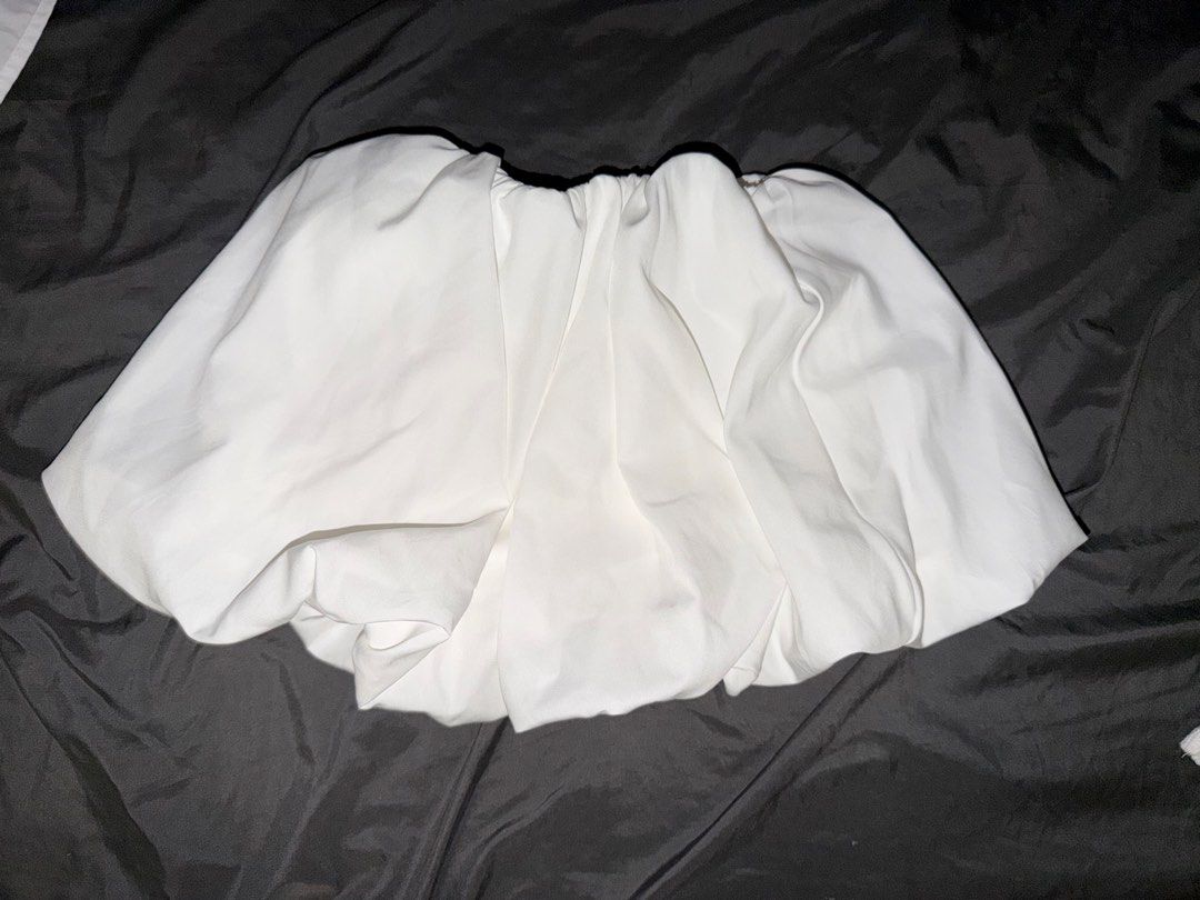 White Bubble Skirt (Category: Skirts) located in Makati City. Submitted by prelovedloot (Listing ID 1466107042, Image 1). Description: - Color: White - Style: Super puffy bubble skirt with high volume - Waistband: Garterized / easy stretch elastic - Fabric: Smooth and lightweight - Versatility: Easy to dress up for events or keep casual for daily wear.