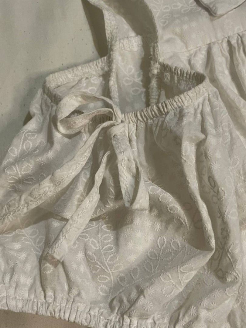 White Cold Shoulder Ruffle Blouse (Category: Blouses) located in Binan City. Submitted by declutterbyjwy (Listing ID 1466092022, Image 3). Description: bust: up to 38-39" | length: 17" - can fit s-m - working buttons - cotton fabric.