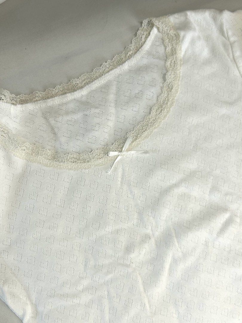 white lace trim short sleeve top (Category: Shirts) located in Manila. Submitted by nikkishops (Listing ID 1466034049, Image 2). Description: heart-pointelle style design. scoop neck with cream lace trim, vvv pretty!!! 😍 presko fabric, perfect for school or casual wear :) M-L!.