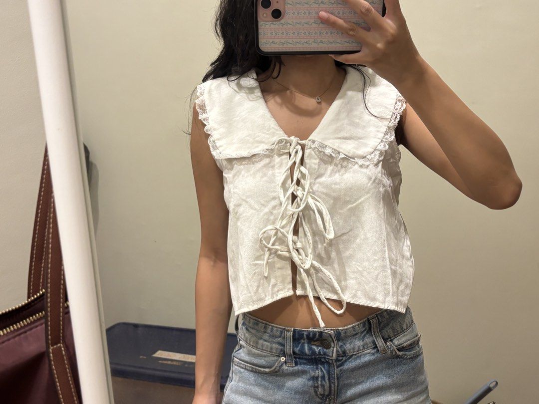 White linen collar tie front top (Category: Blouses) located in Paranaque City. Submitted by domisclosett (Listing ID 1466096532, Image 2). Description: - Color: White - Style: Sleeveless crop top - Details: Wide peter pan collar with delicate lace trim, multiple front tie closures loc: parañaque/muntinlupa area mop: gcash, maribank, gotyme mod: lalamove or j&t, sf c/o buyer.