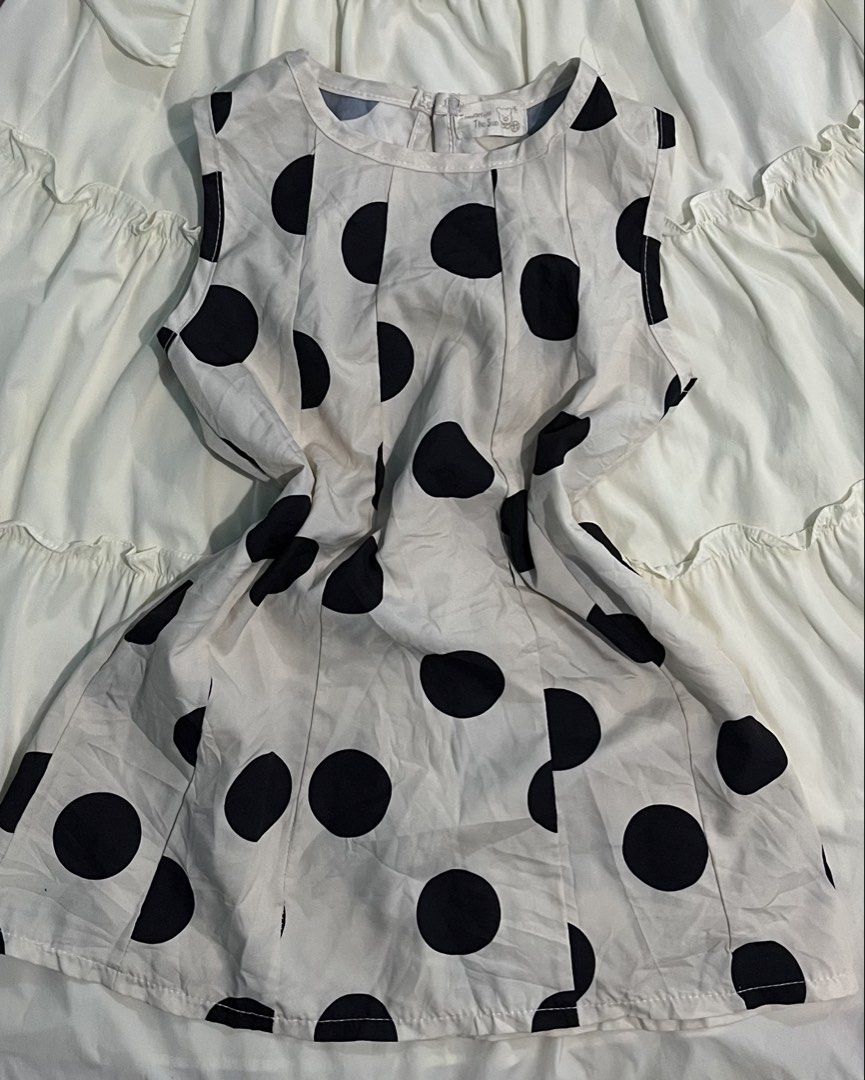 White Polka Dot Sleeveless Top (Category: Others Tops) located in Kapalong. Submitted by elleclo (Listing ID 1466048248, Image 1). Description: - Pattern: Classic black polka dots on white - Details: High round neckline, pleated front panels, back zipper closure - Fabric: Lightweight and breathable .