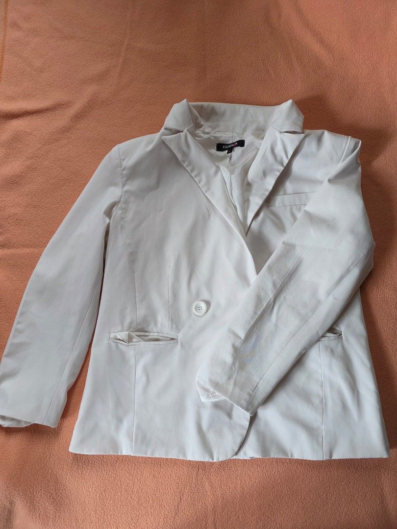 White single-button blazer jacket size L (Category: Coats, Jackets and Outerwear) located in Baguio. Submitted by ozozo1999 (Listing ID 1465986797, Image 1). Description: - Style: Single-button blazer jacket with lapel collar - Color: Neutral white - Size: L - Details: Front pocket accents and structured shoulders - Fabric: Smooth finish - Condition: Clean overall, highly versatile for various outfits 350 for H&M puffer vest @Medium 350 for white