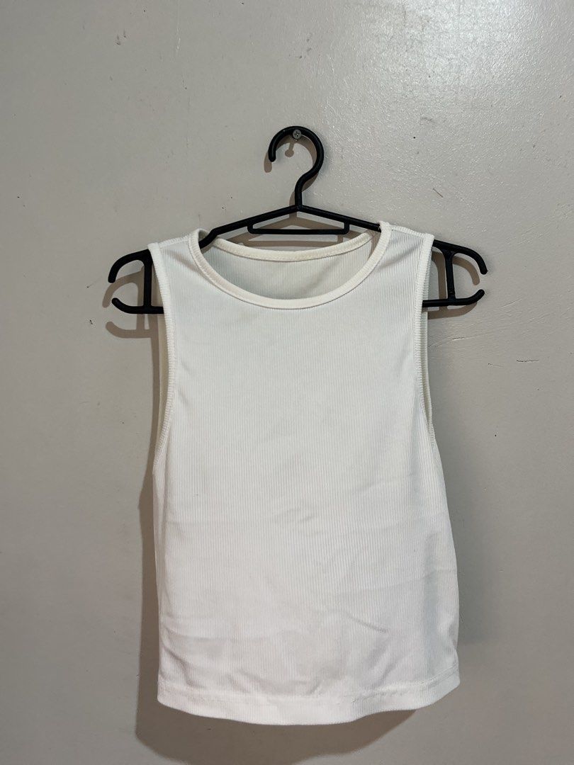 White tank top shein (Category: Sleeveless) located in Manila. Submitted by serra_shop (Listing ID 1466117224, Image 2). Description: Sold out on shein Minimal stain Size: Small Location: Pampanga Courier: J&T.