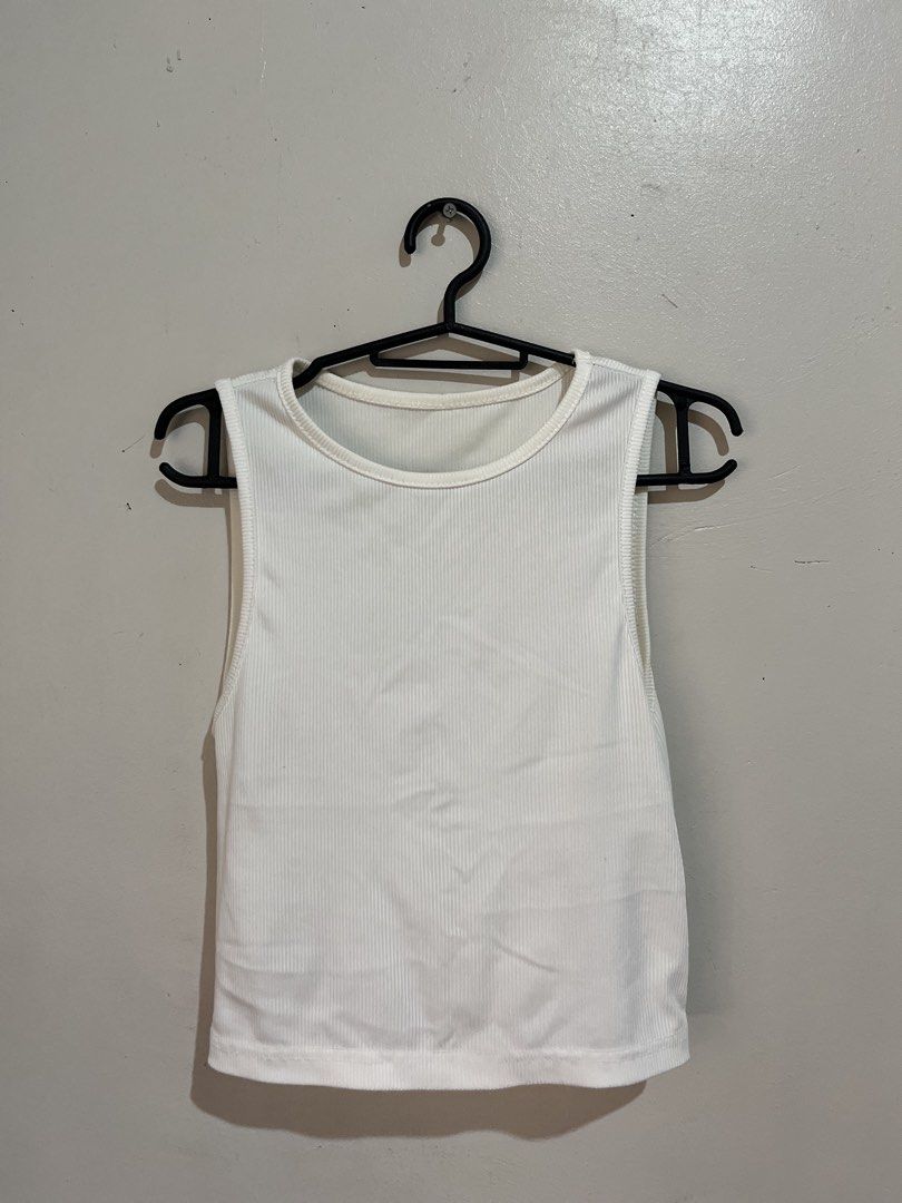 White tank top shein (Category: Sleeveless) located in Manila. Submitted by serra_shop (Listing ID 1466117224, Image 1). Description: Sold out on shein Minimal stain Size: Small Location: Pampanga Courier: J&T.