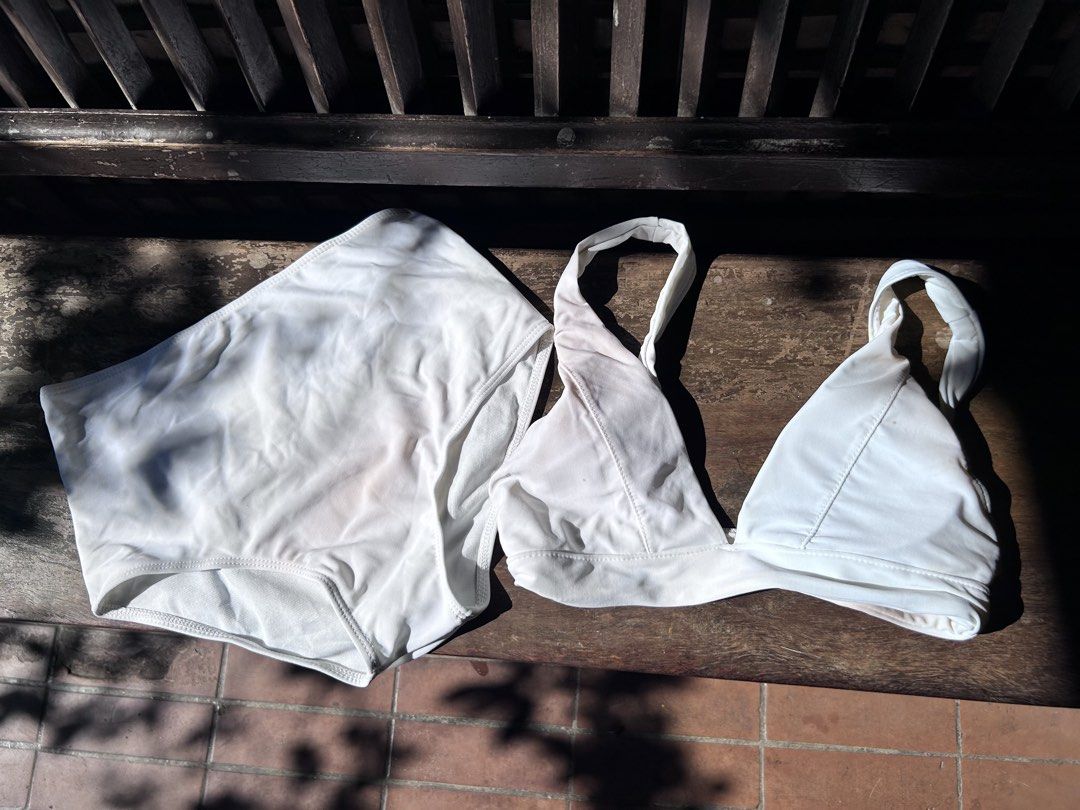 White Two Piece Bikini Swimwear Set (Category: Bikinis & Swimsuits) located in Makati City. Submitted by hzsans92 (Listing ID 1466102184, Image 1). Description: - Color: Clean white - Style: Two-piece bikini set - Top: Triangle cut with thick, comfortable halter straps - Bottoms: High-waisted design with full coverage - Design: Simple and plain, easy to mix and match - Perfect for: Beach days, pool parties, and swimming - Condition: Brand new - B