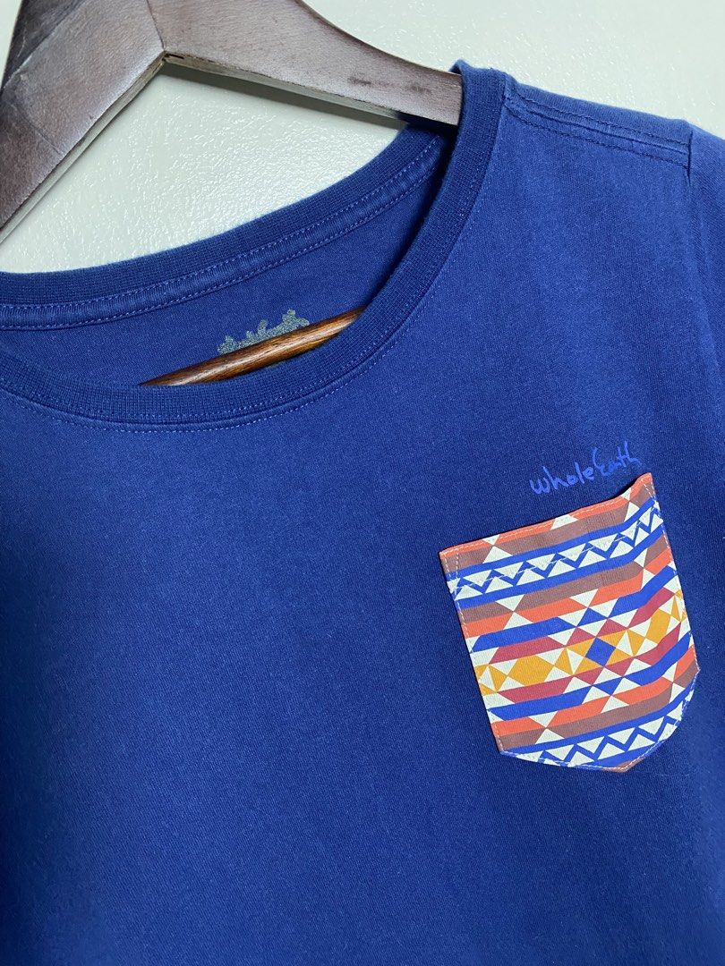 Whole earth Japan pocket tee (Category: Shirts) located in Makati City. Submitted by indaysukaycloset (Listing ID 1466019703, Image 2). Description: WHOLE EARTH JAPAN POCKET TEE Brand: Whole Earth - Japan Brand Color: NVY (48) - Royal / Navy Blue Size: M on tag - Fits S-M for girls, S for boys Details: - Material: Cotton 100% - presko, soft, hindi mainit - Pocket: Tribal / Aztec / Navajo print - orange, blue, yellow - Front logo: "Whole Earth" sm