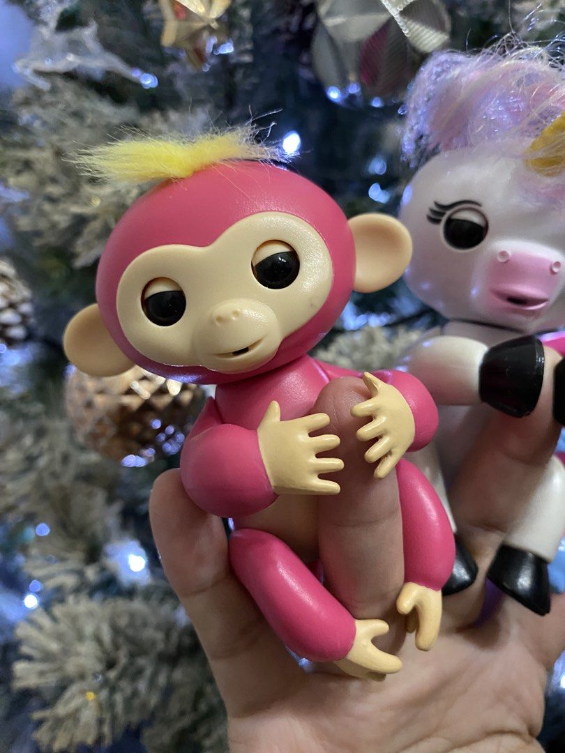 WowWee Fingerlings Bella (Category: Kids Toys) located in Las Pinas. Submitted by sherylandmargaux (Listing ID 1466126713, Image 1). Description: • Interactive Sensors: The toy reacts to touch, motion, and sounds with blinking eyes, head turns, and a variety of cute monkey babble. • Grip Design: Its arms and legs are specially molded to clip snugly onto fingers, markers, or computer monitors. • Poses: You can hang them upside down by their curly 
