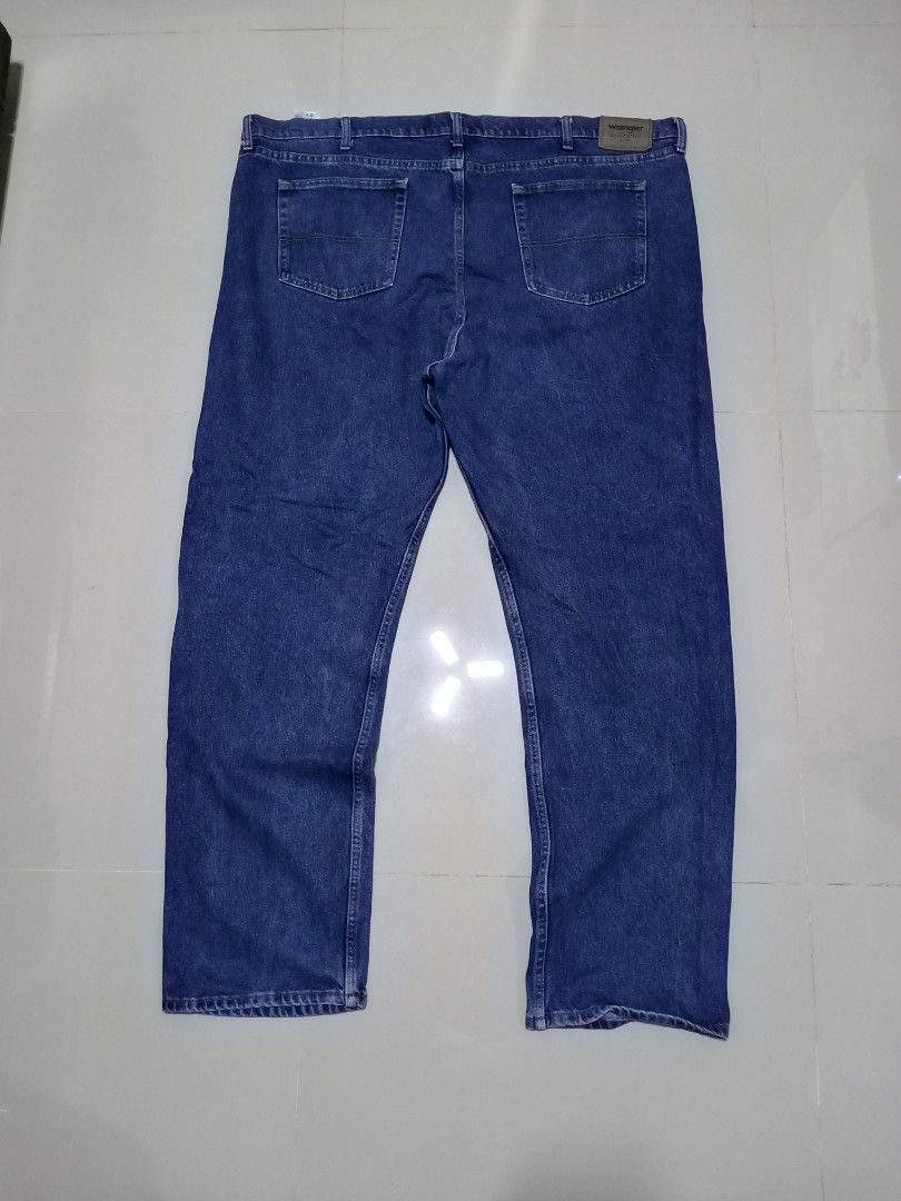 Wrangler Denim Blue Pants Size 48x34 (Category: Jeans) located in Magdalena. Submitted by magdalenathrift20 (Listing ID 1466085524, Image 3). Description: Wrangler denim blue pants, size 48x34. Classic straight-leg style with button closure and belt loops. Back pockets include the signature Wrangler patch. Made in Mexico from 100% cotton denim. Solid blue wash with everyday wear..