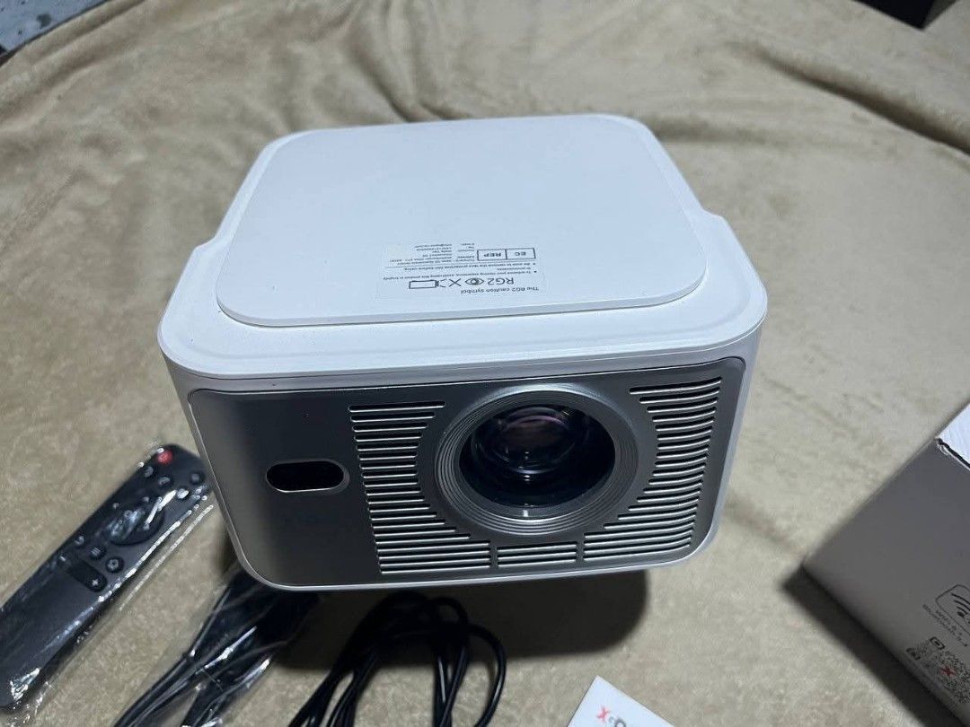 XGODY GIMBAL 7 PROJECTOR (Category: Projectors) located in Quezon City. Submitted by jcrafty.co (Listing ID 1465967397, Image 2). Description: FOR SALE XGODY GIMBAL 7 7000 ONLY NEGOTIABLE!! BRAND NEW Optical & Projection Specs Native Resolution: 1080p Full HD (1920 x 1080) Supported Resolution: Up to 4K/8K decoding at 60fps Brightness: 900 to 1300 ANSI Lumens (varies slightly by market configuration) Contrast Ratio: 2000:1 with HDR10, HDR10+, and