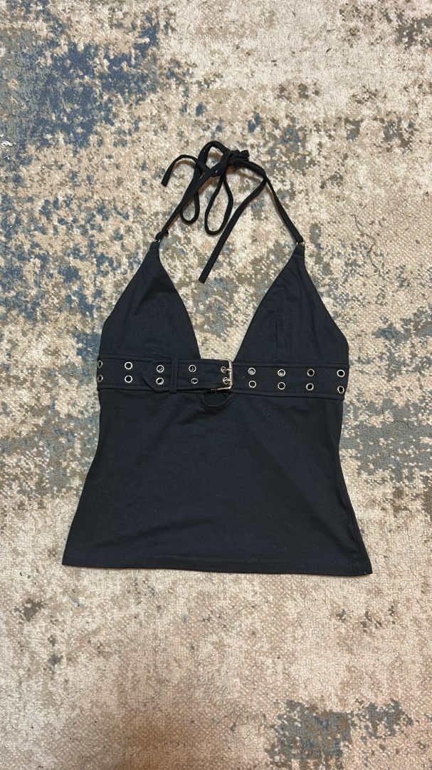 y2k cami top (Category: Sleeveless) located in Manila. Submitted by cvntlab (Listing ID 1466121889, Image 1). Description: Edgy black halter top featuring a built-in front belt with silver eyelets and a buckle. Designed with a deep V-neck, adjustable tie straps, and a flattering slim fit in soft cotton. Perfect for nights out and concerts. Send a message for inquiries!.