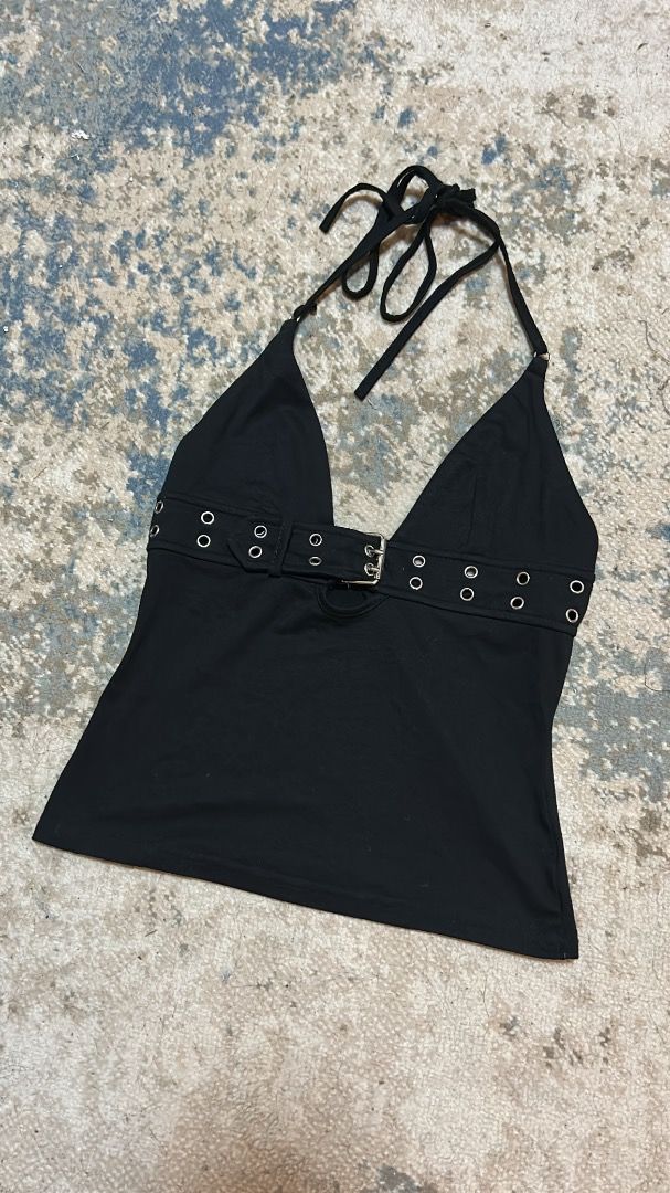 y2k cami top (Category: Sleeveless) located in Manila. Submitted by cvntlab (Listing ID 1466121889, Image 2). Description: Edgy black halter top featuring a built-in front belt with silver eyelets and a buckle. Designed with a deep V-neck, adjustable tie straps, and a flattering slim fit in soft cotton. Perfect for nights out and concerts. Send a message for inquiries!.