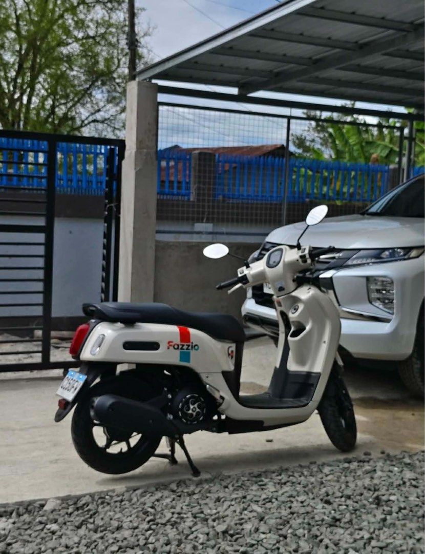 Yamaha Fazzio Scooter White (Category: Motorbikes for Sale) located in Bulacan. Submitted by furnituresantamariabulacan (Listing ID 1466025299, Image 1). Description: - Model: Yamaha Fazzio (Automatic transmission) - Color: White with colorful side stripe decals - Design: Retro round headlight, black seat, and black alloy wheels - Condition: Clean bodywork and exceptionally well-maintained - Performance: Fuel-efficient, perfect for daily commutin