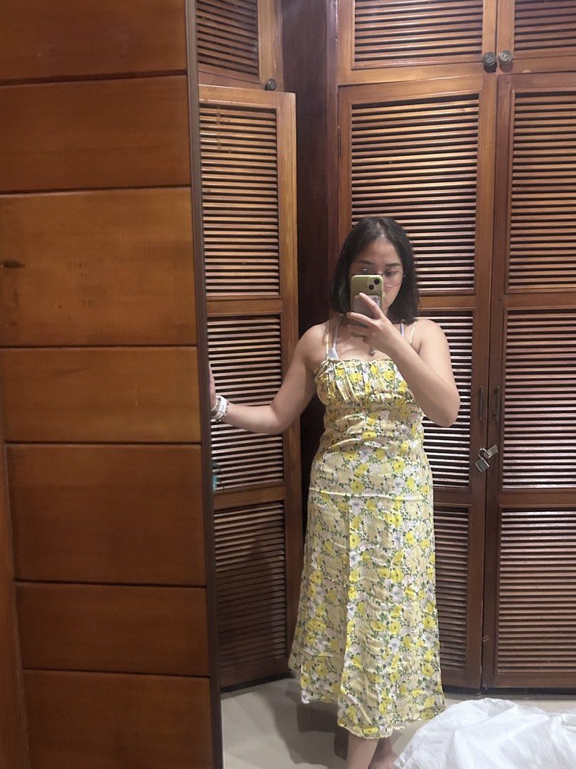 Mango Yellow Floral Midi Dress (Category: Dresses) located in Cebu City. Submitted by shopmikascloset (Listing ID 1466056797, Image 1). Description: - Color & Pattern: Mango yellow with all-over floral print - Design: Spaghetti straps, square neckline, and gathered ruffling across the bust - Fit & Length: Comfortable fit, lightweight fabric, midi length - Size: EUR M / USA S - Perfect for: Sunny days, beach trips, and casual hangouts.