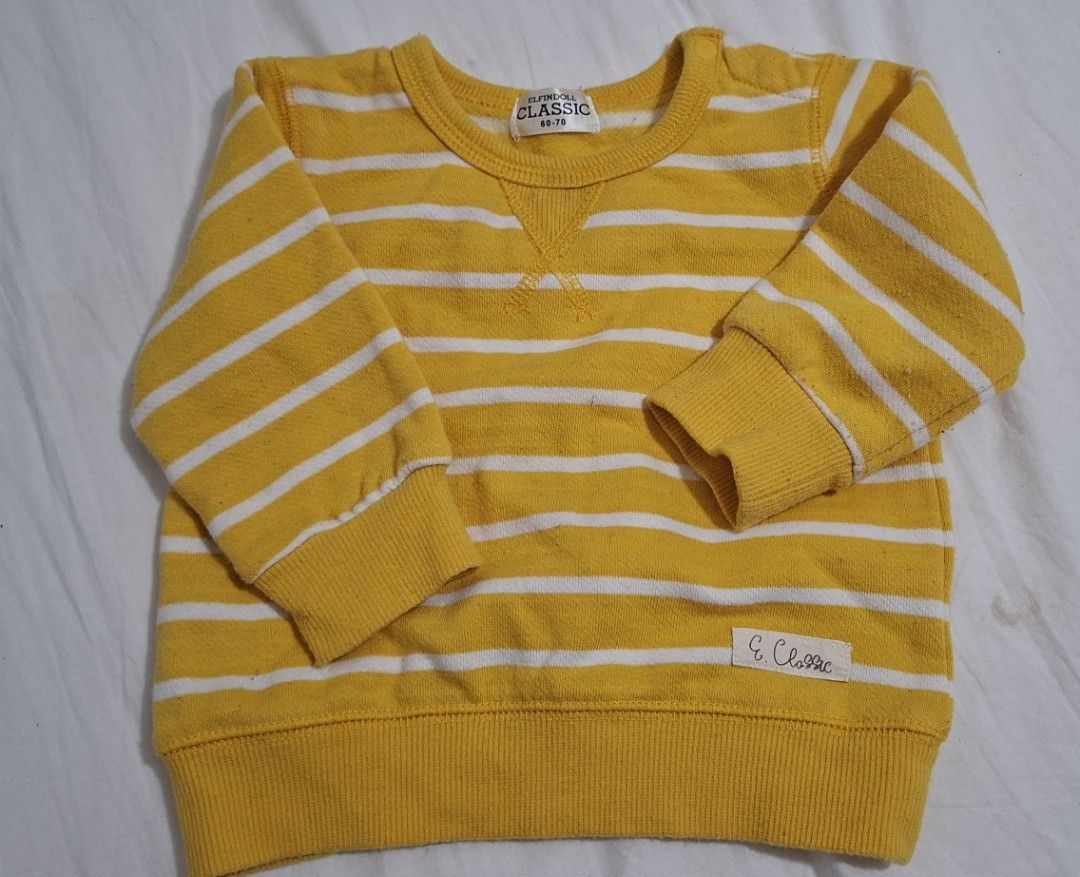 Yellow White Striped Baby Sweater (Category: Babies & Kids Fashion) located in Taguig. Submitted by wolffangs (Listing ID 1466009368, Image 1). Description: - Brand: Elfindoll Classic (bought in Japan) - Size: 60-70cm / 6-12months - Features: Long sleeves, ribbed cuffs and hem, shoulder snap buttons for hassle-free dressing - Condition: excellent like new, only used a few times while in Japan - Inner material is thin fleece.