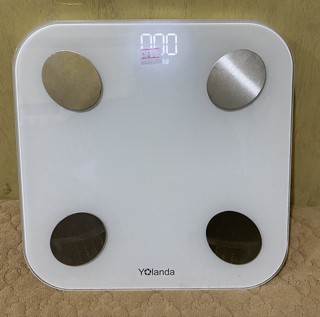 Yolanda CS20H Smart Body Fat Scale White (Category: Health Monitors & Weighing Scales) located in Baguio. Submitted by thrift_bonita (Listing ID 1466054292, Image 1). Description: - Brand: Yolanda Smart Body Fat Scale - Model: CS20H (White) - Capacity: Up to 150kg - Features: 4 metallic electrode pads, clear digital LED display, compact square shape with rounded corners - Base: 4 non-slip feet and reset button with tech spec label - Condition: Cl