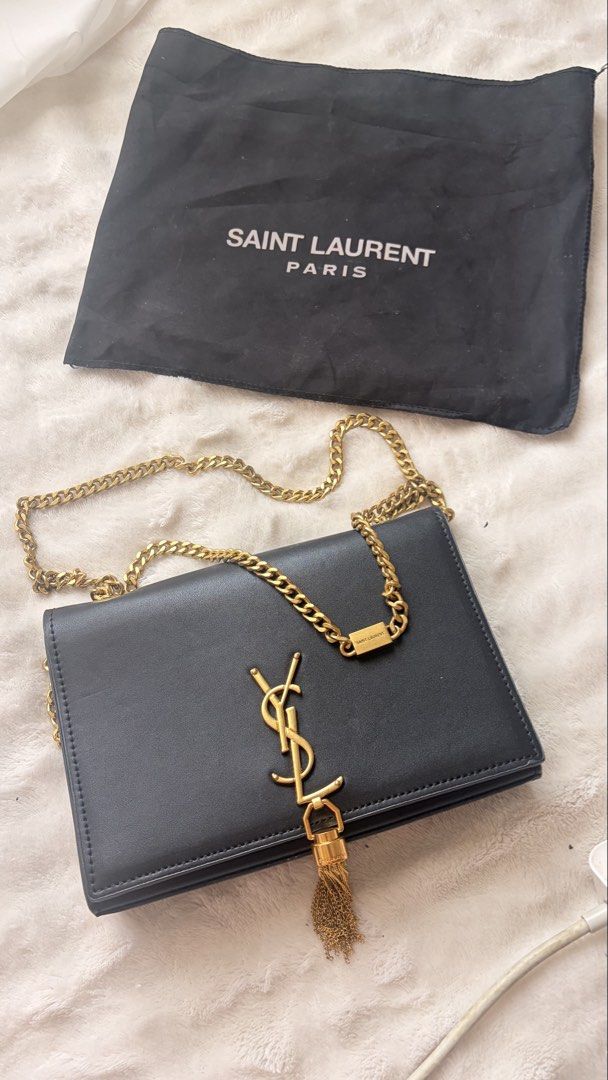 YSL Bag (Category: Purses & Pouches) located in Taguig. Submitted by maggiemajiing (Listing ID 1465971893, Image 3). Description: Bought it 13k. selling it for 1k. Only used thrice. :) cute bag for date night! 💖.